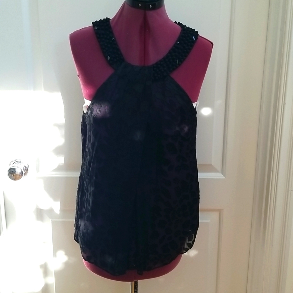 Eci New York black top, beaded neckline,and purple underlay Size 10